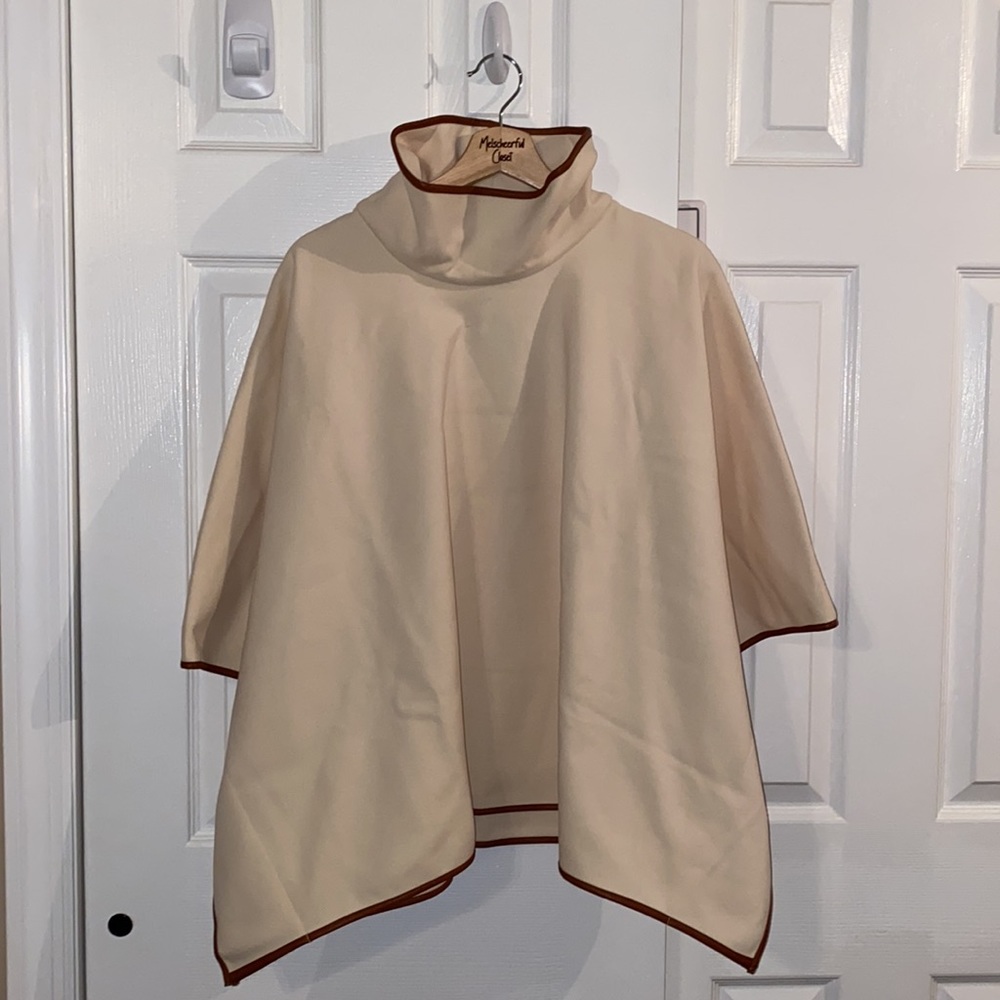 Ivory Pearl Leather Trim Funnel Neck Piper Poncho
TUCKERNUCK - Picture 7 of 8